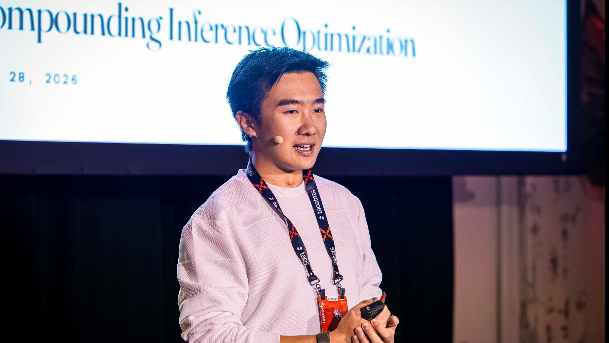 Xavier Lyu on stage at Exploit Summit, in front of a slide titled Compounding Inference Optimization
