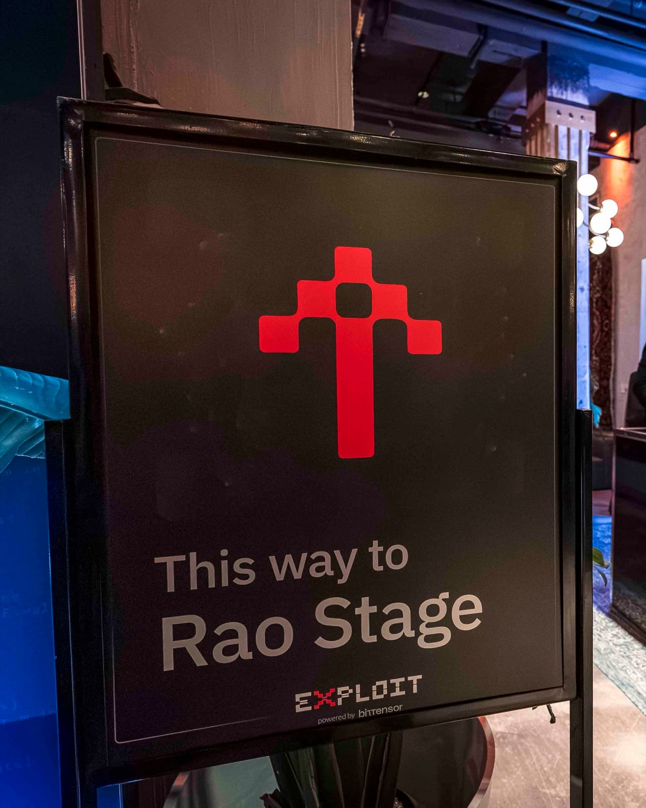 A sign at New City Gas reading This way to Rao Stage, Exploit, powered by Bittensor